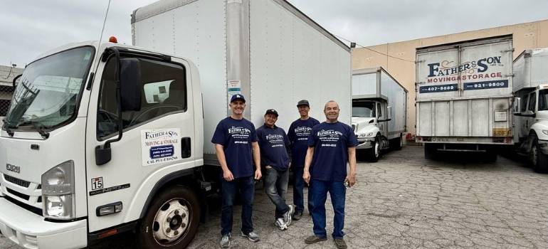 movers in Glendale CA carrying a moving box