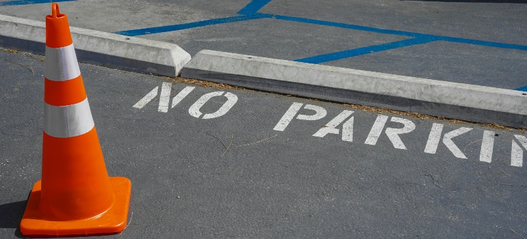 Cone by No Parking Horizontal Sign